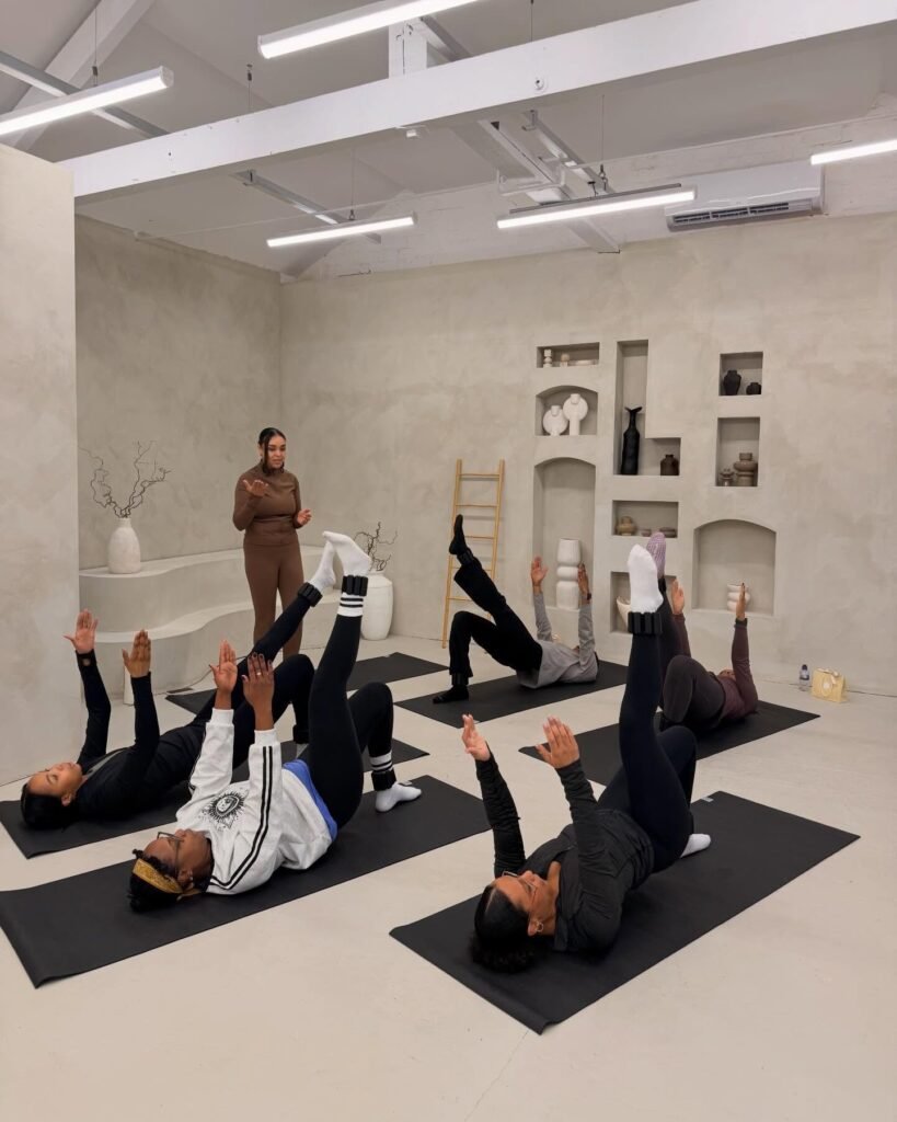 Instructor-led Pilates class on mats at JD Content Studios