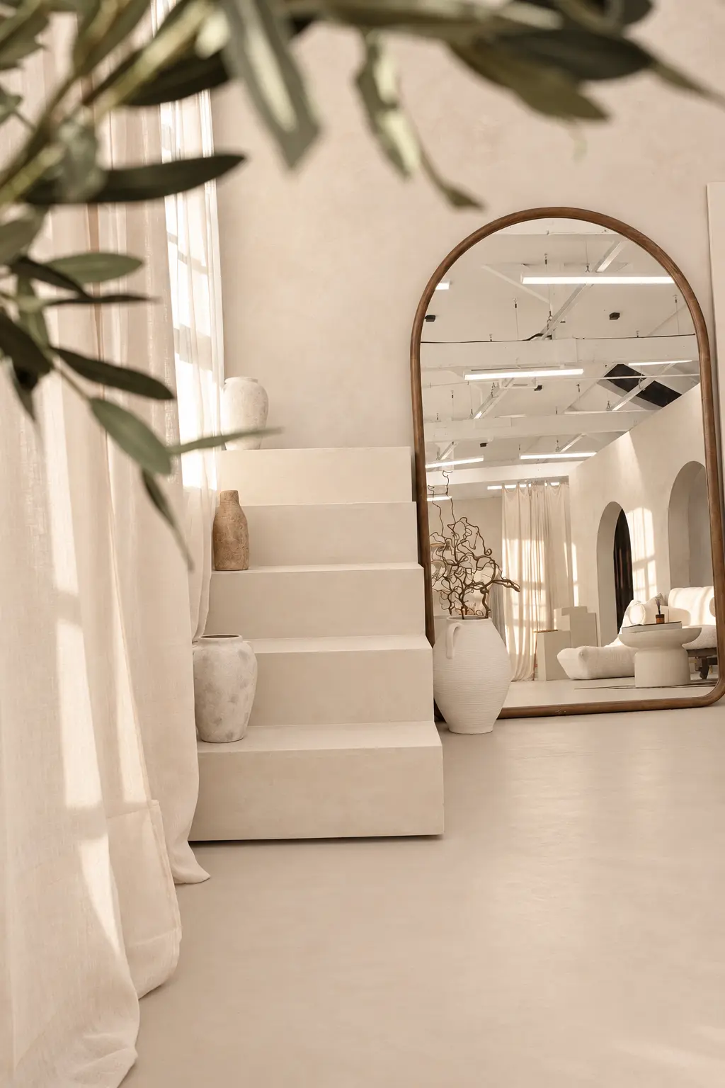 The Sanctuary — arched mirror and stepped plinths