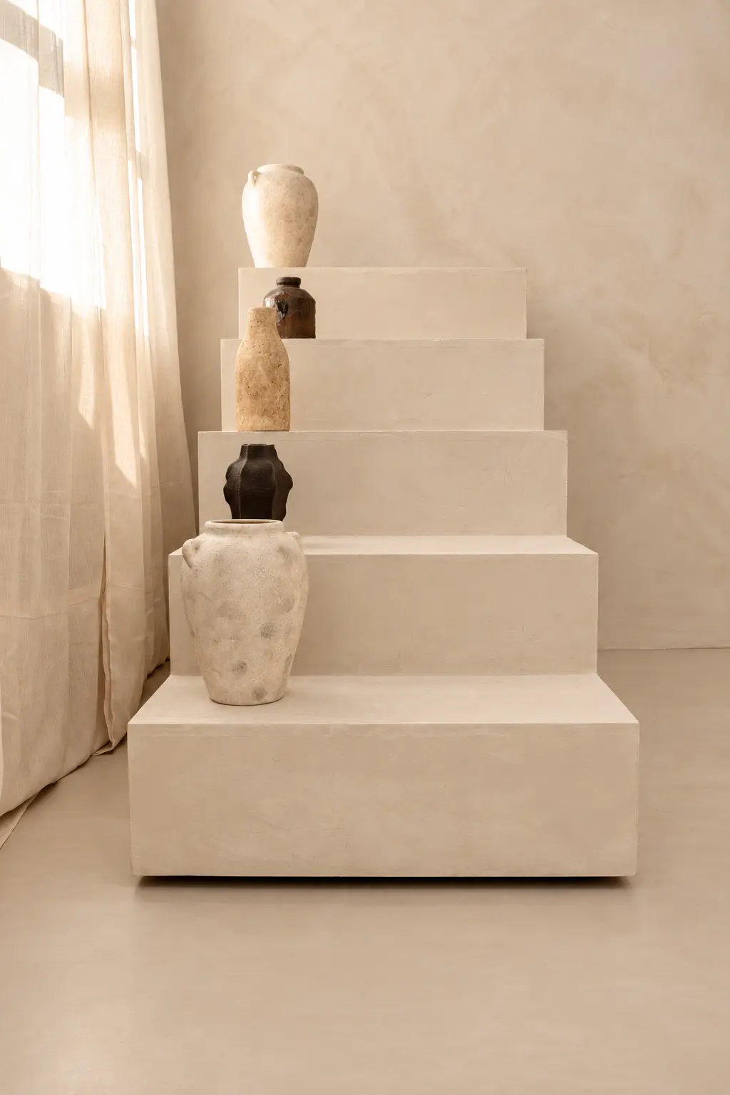 The Sanctuary — ceramic detail on stepped plinths