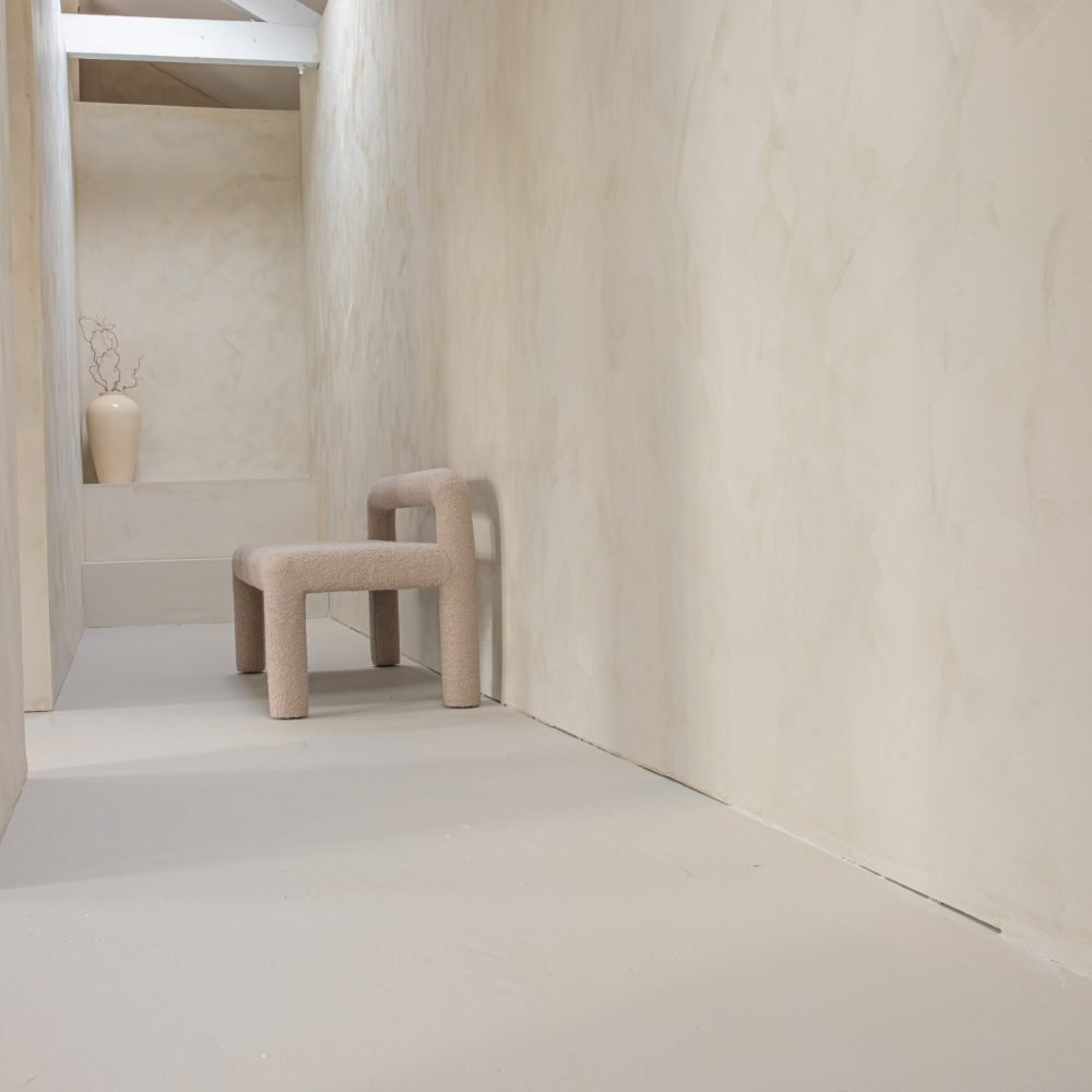 Sanctuary Photo Studio - Minimalist interior with textured walls.